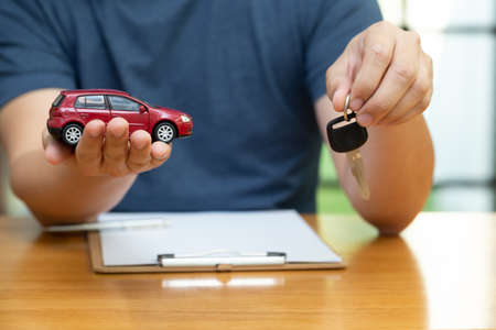 Men are choosing to buy and sign contracts policy with vehicle and car insurance, Protection of car conceptの写真素材