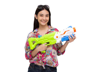 Young Asian beautiful woman holding plastic water gun isolated on white background, Songkran...