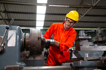 Heavy industrial worker is working on metal work factory, Machine for steel structure industry...
