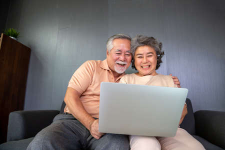 Asian senior couple talking in video call chat on laptop computer, Smart technology for old age and...