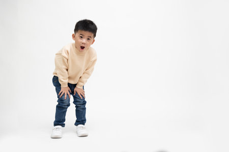 Cheerful little boy express surprise face or wow isolated on white background, Happy Asian child model, Full length people compositionの写真素材