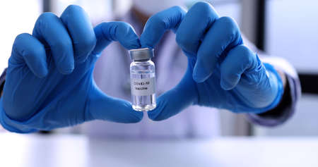 Doctor or scientist in laboratory holding covid-19 vaccine, Coronavirus disease vaccine research and...