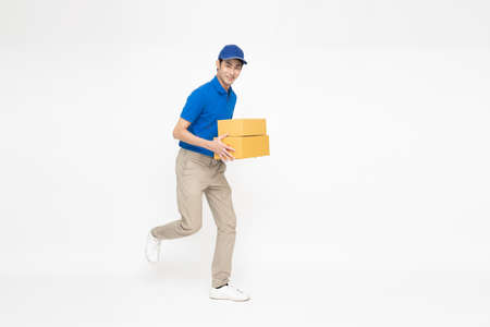 Happy Asian deliveryman smiling and holding package parcel box isolated on white background, Delivery courier and shipping service concept, Full Length people compositionの写真素材