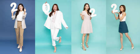Collage with different attractive beautiful Asian businesswoman holding 2022 numbers, New year conceptsの写真素材