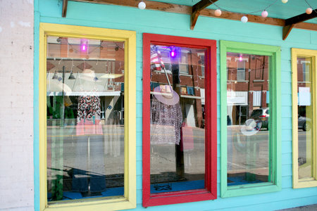 Colorful shop window with clothes hanging on it in the historic downtown of Bristow, Oklahoma....