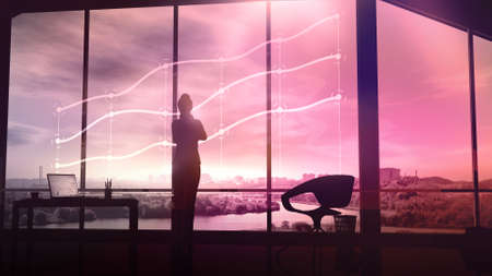 Silhouette of a businesswoman looks at the holographic infographics.