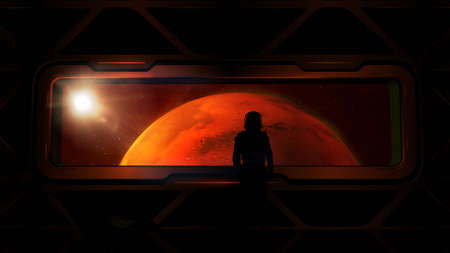 Astronaut at the porthole of a ship approaching Mars.の写真素材