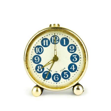 Old clock made in USSR on white backgroundの写真素材