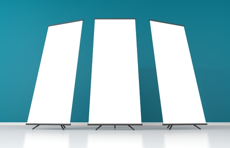 Set of three blank white roll up posters - vertical billboard for textの写真素材