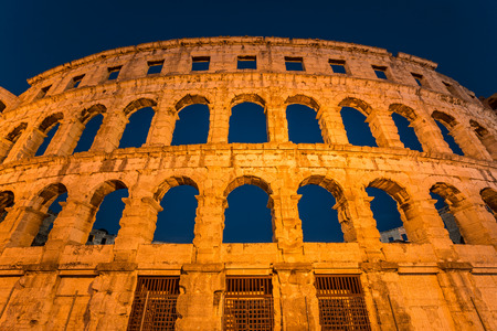 Pula Arena at blue hour. The Roman Amphitheater of Pula, Croatia