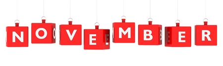 November calendar background - word text on glossy red cubes hanging on white backgroundの写真素材