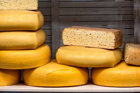 Pieces of cheese and cheddar prepared by the house, at the Christmas marketの写真素材