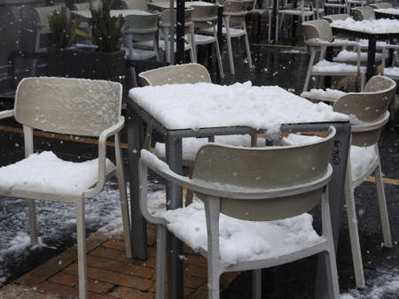 Snow covered terrace of a barの写真素材