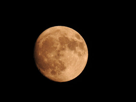 Stunning full moon over black skyの写真素材