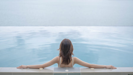 One female person relaxation in water pool in summer vacation, beauty woman happy swimming in luxury...