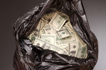 A Rubbish bag full of dollars 
の写真素材