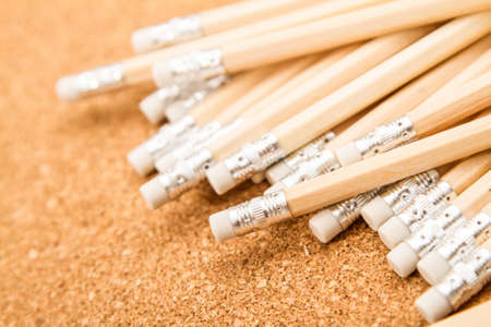 Bunch of wooden pencils over a cork board
の写真素材