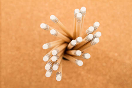 Bunch of wooden pencils over a cork boardの写真素材