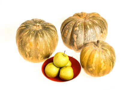 Pumpkins and green apples on a white , isolated
の写真素材