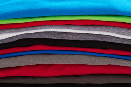 A pile of folded T shirts の写真素材