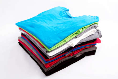 A pile of folded T shirts の写真素材