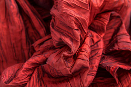 A fancy wrinkled red fabric background
の写真素材