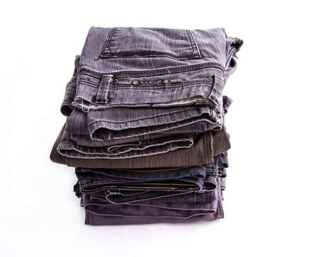 A pile of dark jeansの写真素材