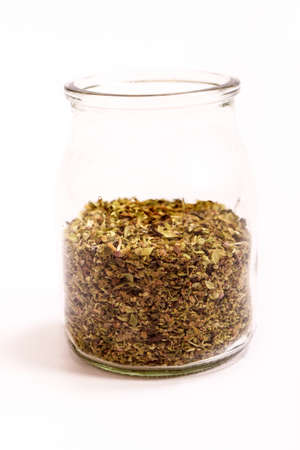 Oregano in a glass potの写真素材