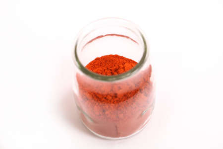 Paprika powder in a glass potの写真素材