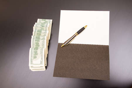 Lots of dollars with an open copybook
の写真素材