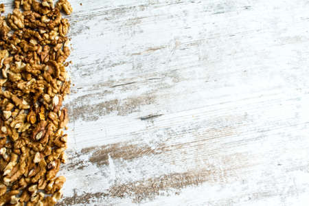 Frame of Walnuts over a wooden table, background
の写真素材
