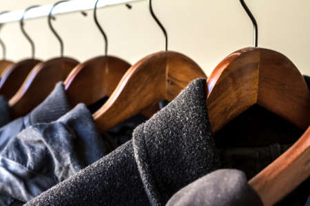 Winter clothes hanged on a clothes rackの写真素材