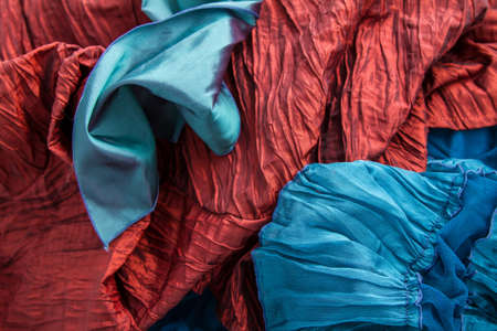 A fancy wrinkled blue and red fabric backgroundの写真素材