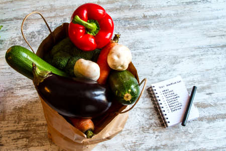 Buying vegetables and fruits, after doing the shopping listの写真素材