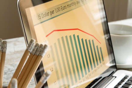 Analyzing graphics with evolution exchange rate euro dollar and doing calculationsの写真素材