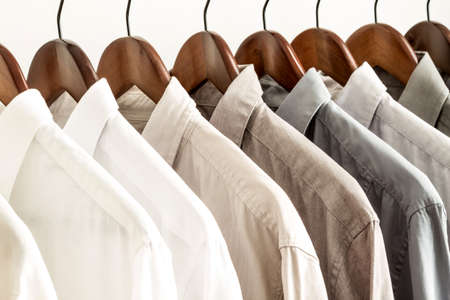 Several shirts on a hanger	 from white to black color rangeの写真素材