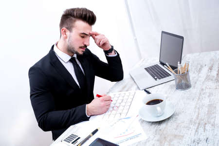 Businessman checking appointments in the calendar at the officeの写真素材