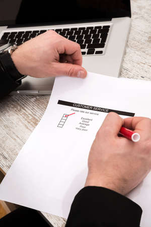 Customer service a businessman rate the serviceの写真素材