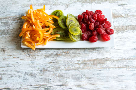 Orange, Kiwi and Strawberry on a plate