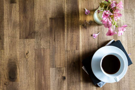 Reading and drinking coffee on a relaxing afternoon.の写真素材