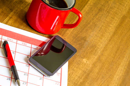 Organizing monthly activities and appointments in the calendarの写真素材