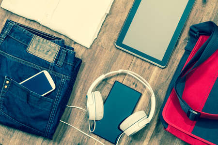 Informal male outfit with electronics, background