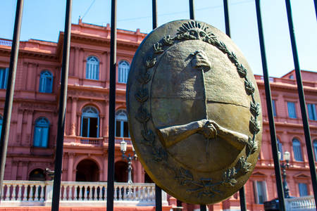 Argentinian Government House, the Â¨Pink HouseÂ¨, in Buenos Aires, with the national emblem in the forefrontのeditorial素材