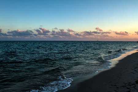 Lonely beach at sunset