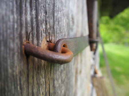 Traditional vintage door lock on the bath house door.の写真素材