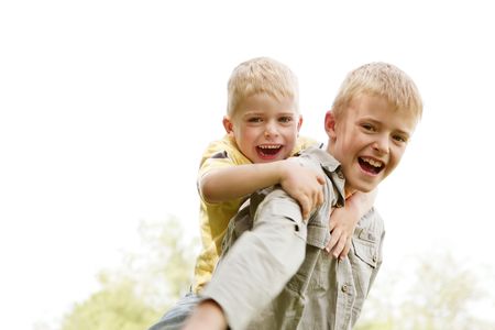 Portrait of two smiling boys having fun in natureの写真素材