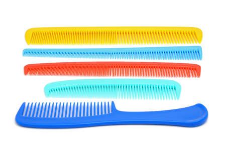 Five colour hairbrushes on the white backgroundの写真素材