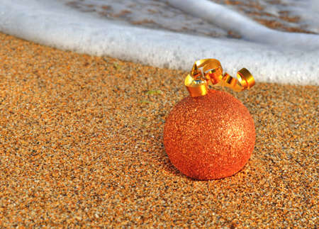 Christmas decoration on the yellow beach sandの写真素材