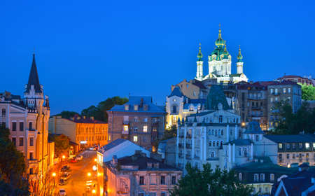 Kiev, Ukraine. Beautiful night view of the ancient street Andrew's Descent and the St. Andrew's Church from the Castle Hill in Kyivの写真素材