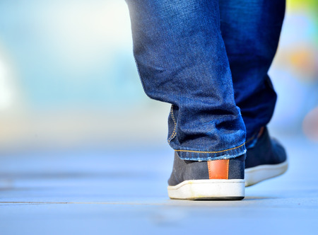 Close up of person walking on street